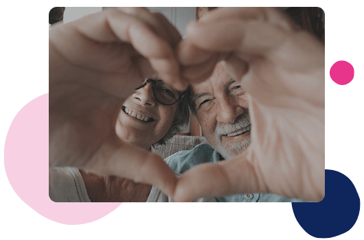 two people making a love heart with their hands